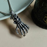 Load image into Gallery viewer, Skull hand Pendant
